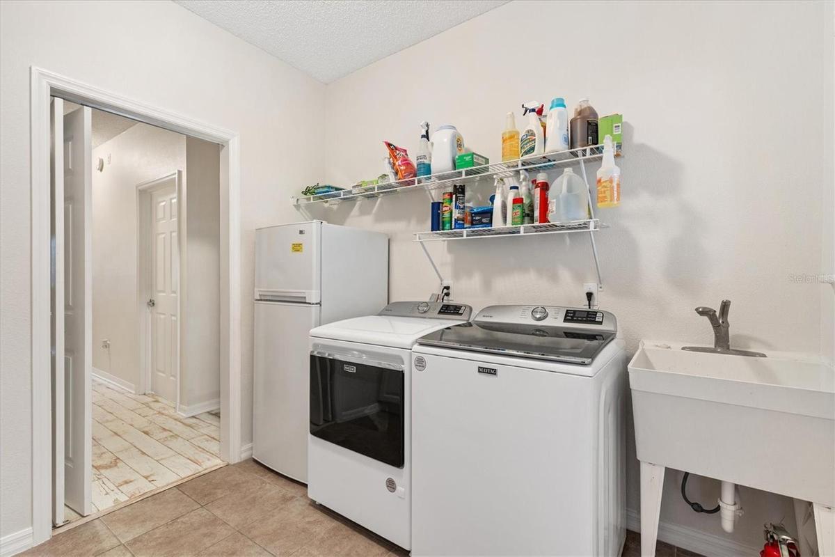 1st Floor-Inside Laundry Room w/ Utility Sink & Refrigerator