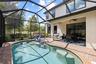 Fully enclosed pool area and covered porch.