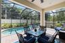 Covered porch area over looking salt water pool. Fully enclosed screen.