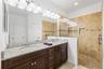 Primary bathroom - tall counters, double sink, wlak in shower, walk in closet and private commode room.