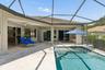 Pool Surrounded by Travertine Decking