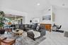 Vaulted ceiling, white tile flooring, sliding glass door, and recessed lighting