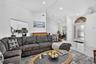 Vaulted ceilings, recessed lighting, and a kitchen pass-through