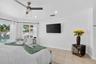 Tiled flooring and recessed lighting illuminate this space