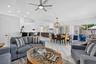 Vaulted ceiling, recessed lighting, tile flooring, contemporary ceiling fan, and sliding glass door