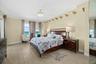 Primary bedroom with balcony access