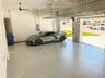 Garage has polyaspartic floor, 12 foot ceiling; fans; music speakers; insulated doors