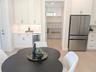 Coffee bar; spacious walk in pantry; under cabinet lighting; beverage cooler.
