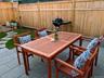 Backyard with bluestone pavers and grassy area