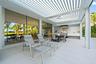 Expansive outdoor living area featuring a louvered patio cover, integrated ceiling fan, and recessed lighting
