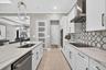 Wood Shaker Cabinet Gourmet Kitchen, high end pendent lights