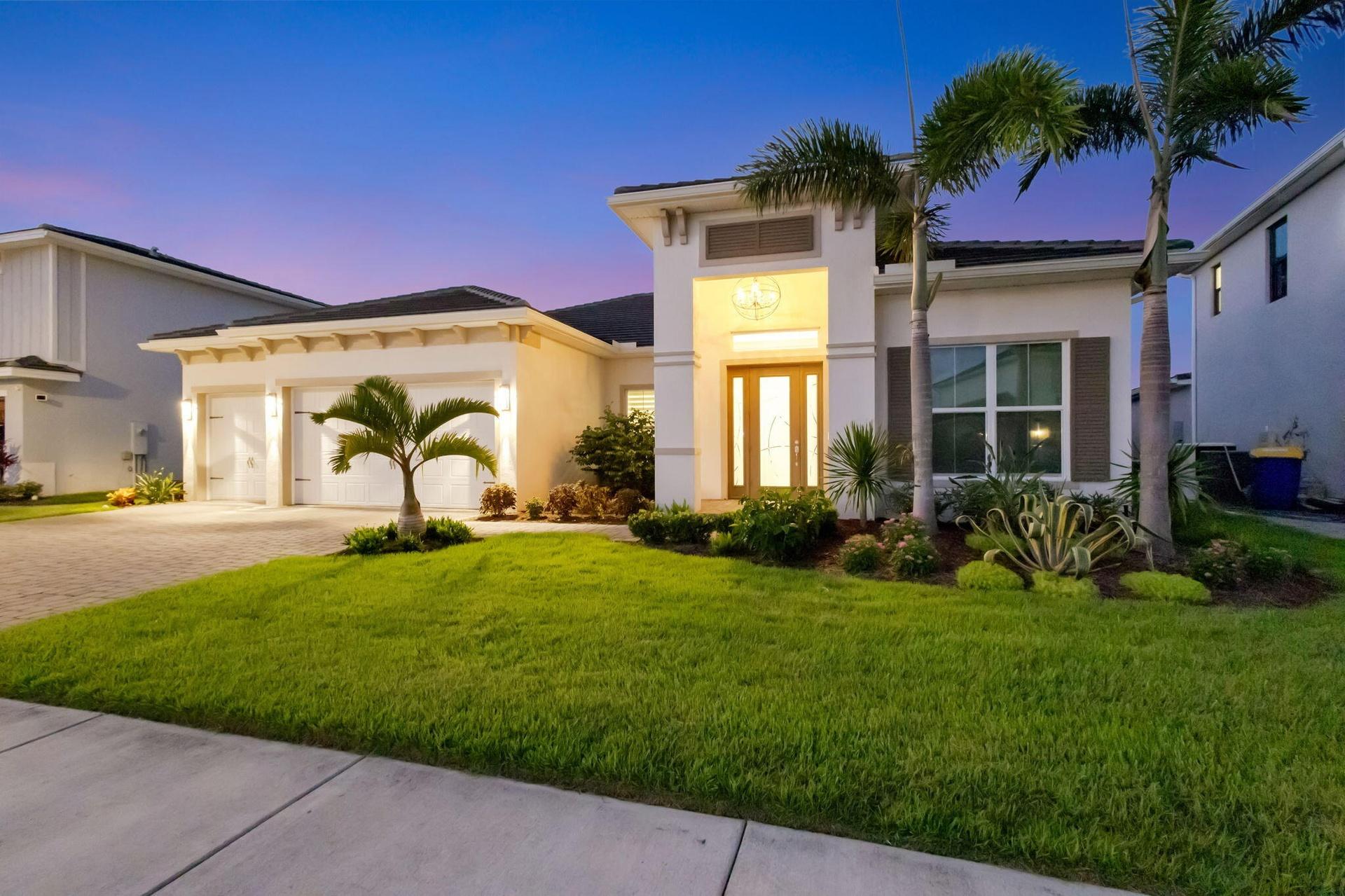 Inviting home with custom landscaping and lighting
