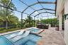 Sun shelf with umbrella attachment on pool sun shelf