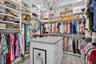 Custom Large Primary Closet #1 with 16 drawer island with stone top. high end cabinet pulls.