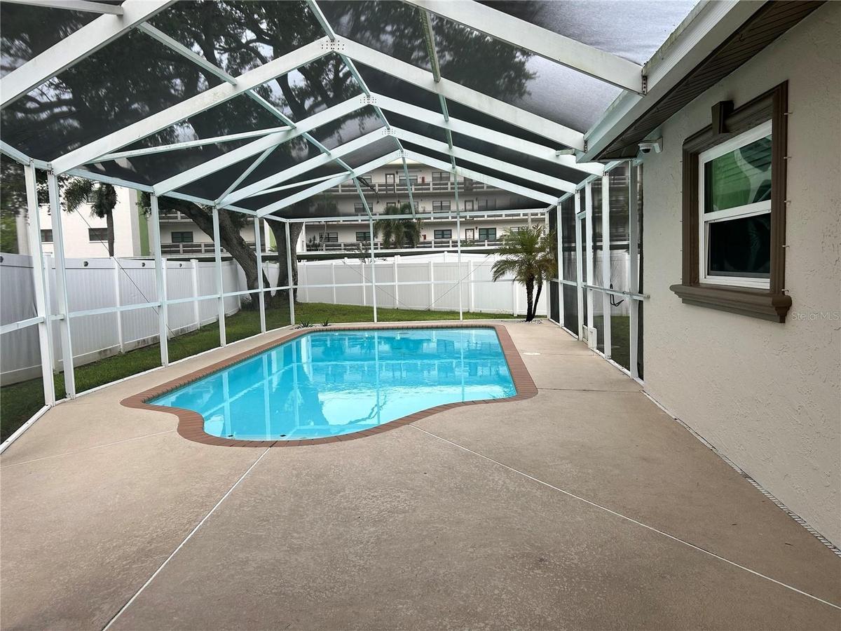 Perfect size in ground pool and screen cage for your outdoor entertainment