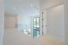 Kitchen island overlooking the family room and walls of glass