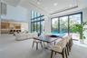 Grand living room with a clerestory balcony and dramatic volume
