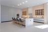 Formal dining area with pool views through floor to ceiling glass
