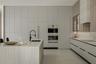 Double-height ceiling, floor-to-ceiling glass wall, kitchen featuring custom flat-panel cabinetry and central island, and glass-paneled staircase rail