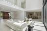 Open plan living area with direct sightlines to the kitchen and outdoor spaces