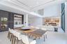 Living area bathed in natural light from full height impact glass