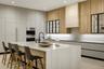 Dining area with custom wood slat feature wall and built in display shelving