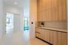 Chef's kitchen with custom wood and lacquer cabinetry and a large island