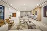 Sleek kitchen with built in appliances, quartz surfaces, and ample storage