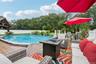 Decking Overlooks Vast Lawn Area with Natural Privacy Behind