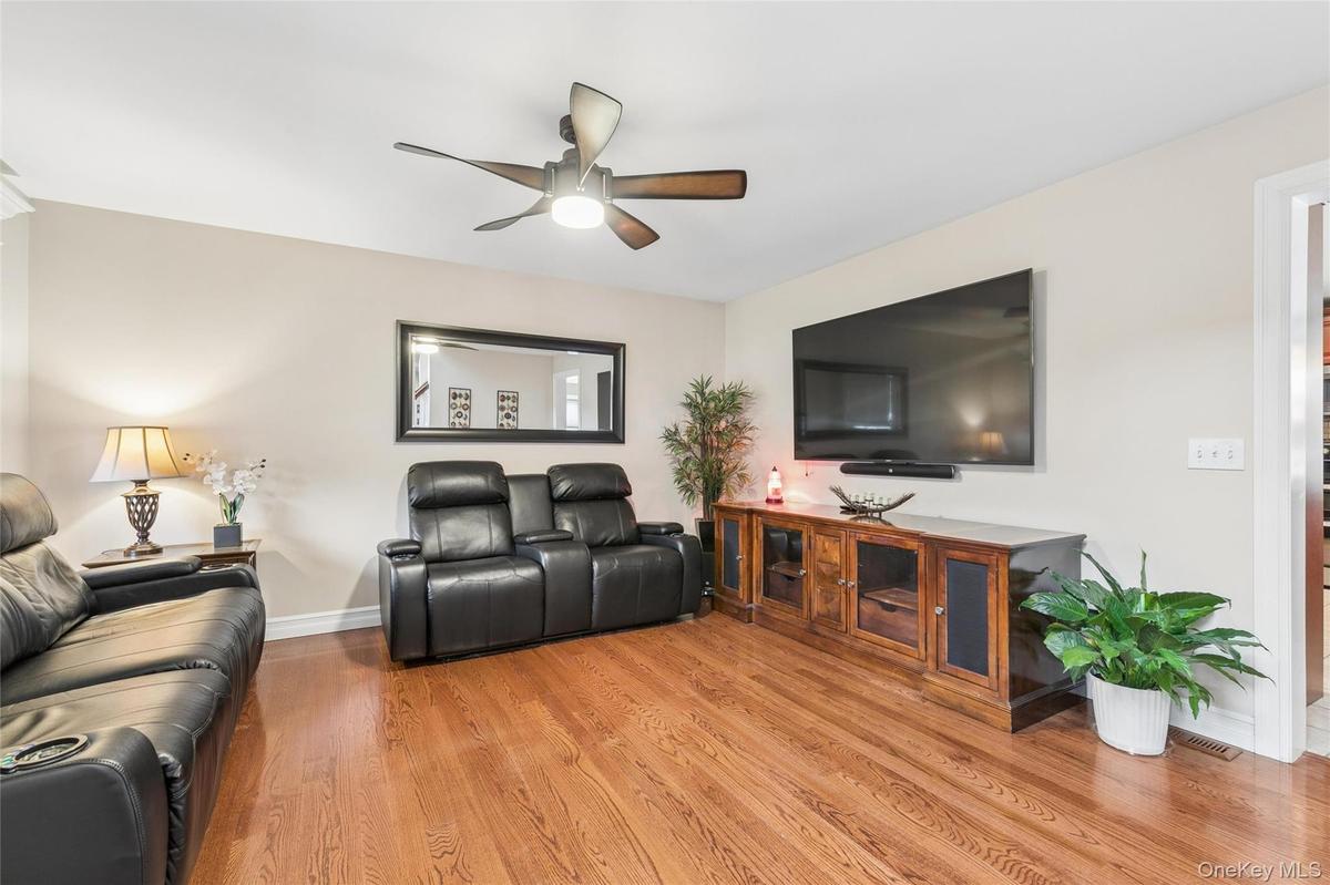 Den with Gleaming Hardwood Floors