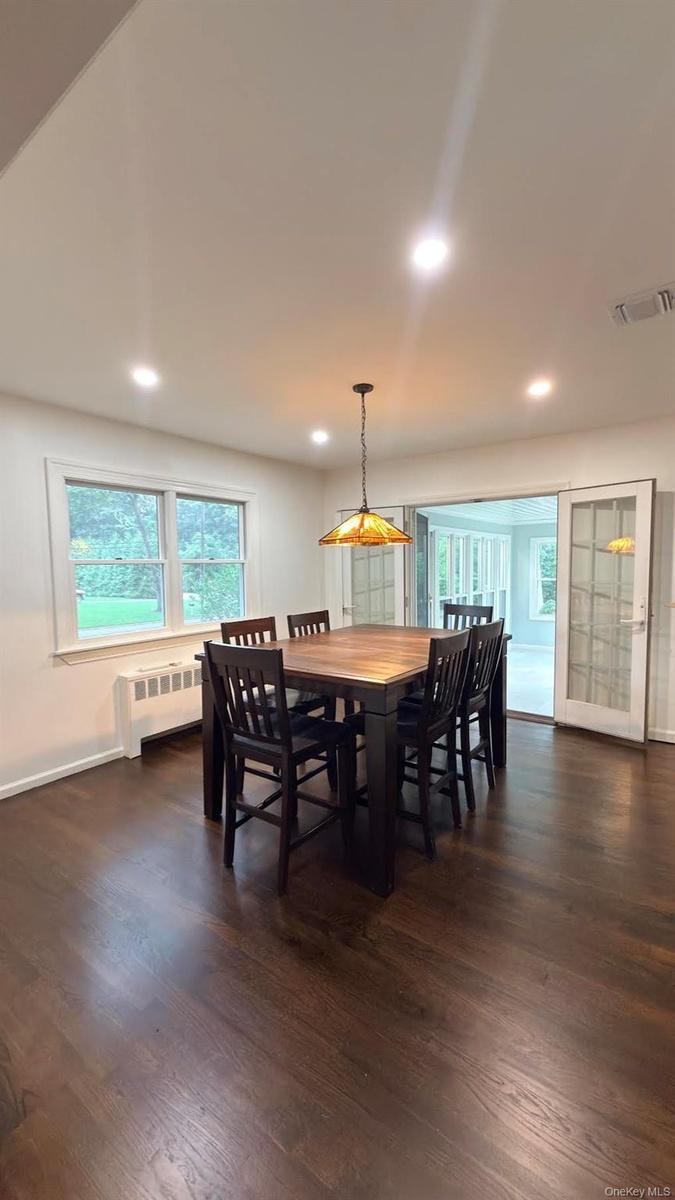 Open to the kitchen and direct access to the all season radiant heated floor porch.