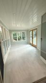 All season porch with radiant heated floors, open to dining room via double doors.