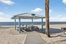 Private beach cabanas and picnic tables