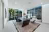 Exceptional executive office featuring a glass wall overlooking the climate-controlled automobile gallery, located within the three-car garage on the 
