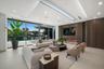 Sophisticated family room positioned beside the showpiece kitchen and separate butler’s kitchen, offering custom cabinetry, a linear fireplace, archit