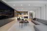 Exceptional first-floor VIP guest suite featuring a spacious private lounge, oversized media wall, full bar, designer finishes, and a private bedroom 