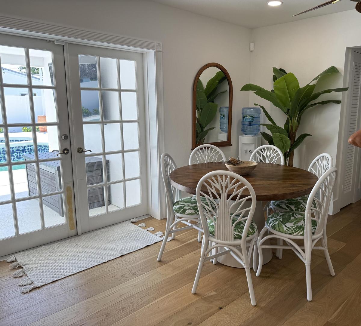 informal dining area opens to covered patio and pool area