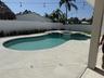 open pool with hot tub