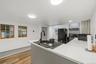 MAIN HOUSE - Another kitchen angle showing the center island, windows and open workspace.