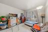 APARTMENT - Second bedroom with natural light and generous floor space.