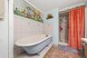 MAIN HOUSE - Full bathroom featuring a tub and shower combination.