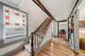 MAIN HOUSE - Another view of the entrance hall, showing the staircase and access to the adjoining rooms.