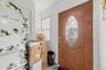 APARTMENT - Interior apartment entrance with decorative glass door.