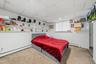 APARTMENT - Bedroom with built-in shelving and storage.