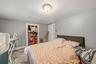 MAIN HOUSE - Second bedroom with natural light and flexible space.