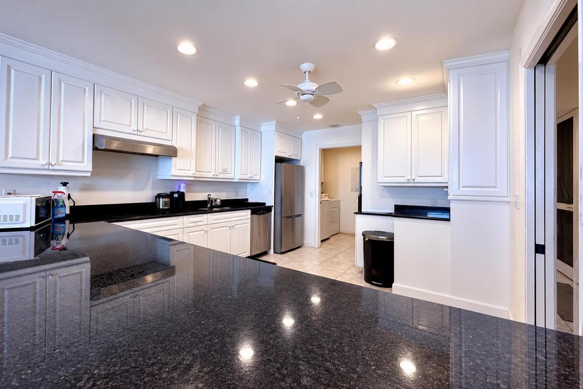 Kitchen with Large Granite Breakfast Bar (files stored edited from photo for privacy)