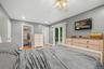 Recessed lighting, wood-finish flooring, walk-in closet, ceiling fan, and sliding glass door