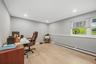 Recessed lighting, light wood-finish flooring, and a window with horizontal blinds