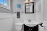 1/2 bathroom.Located on Den level.
