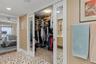 Sliding, mirrored pocket doors to walk in closet